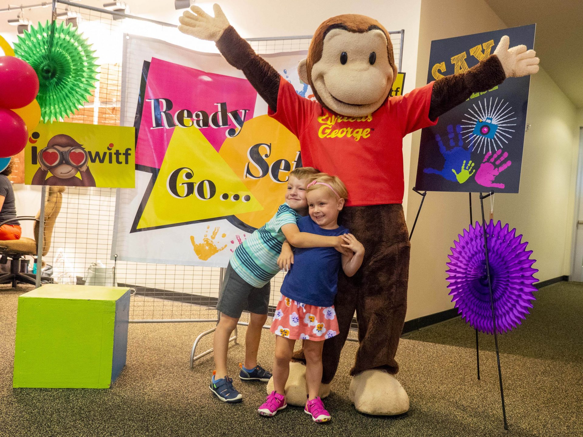 Kids with Curious George at Ready Set Go Kindergarten event